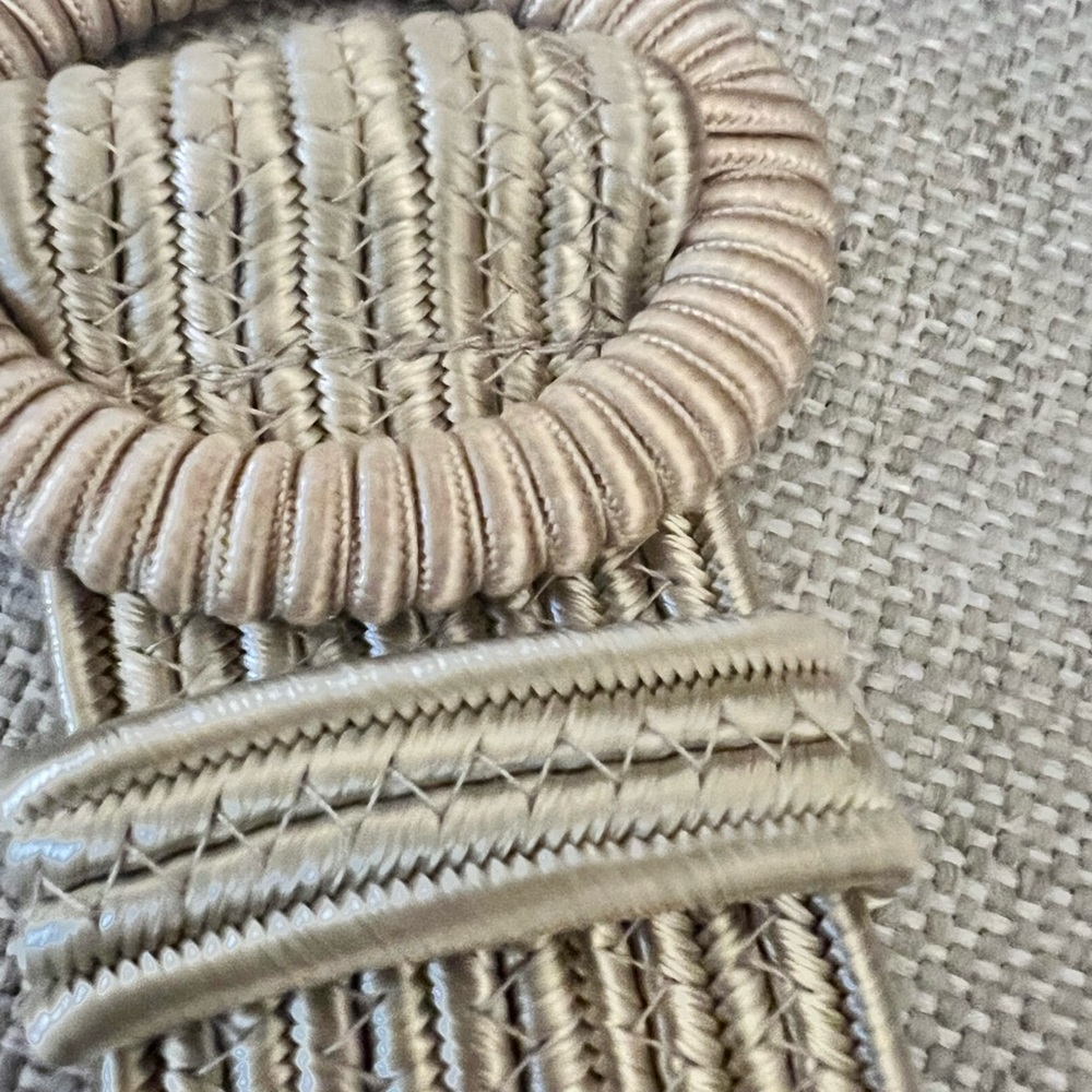 Adjustable woven tan belt. Like new